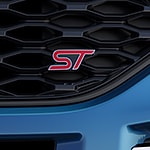 a close of of the fort explorer ST logo on a blue car 