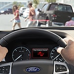 a very close up shot of hands holding a steering wheel 